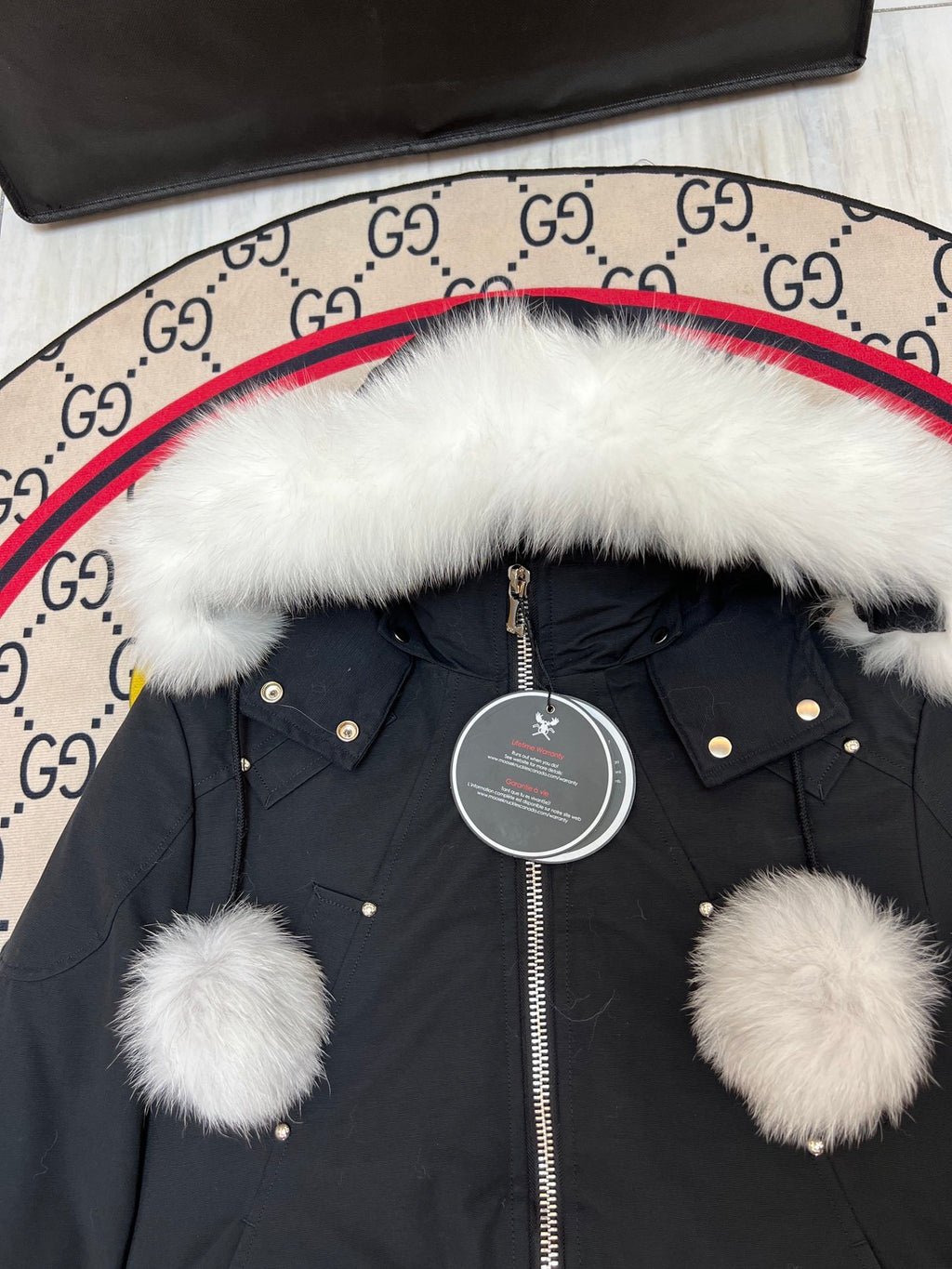 Moose Knuckles Black Hooded Bomber Jacket with Pom-Pom Details