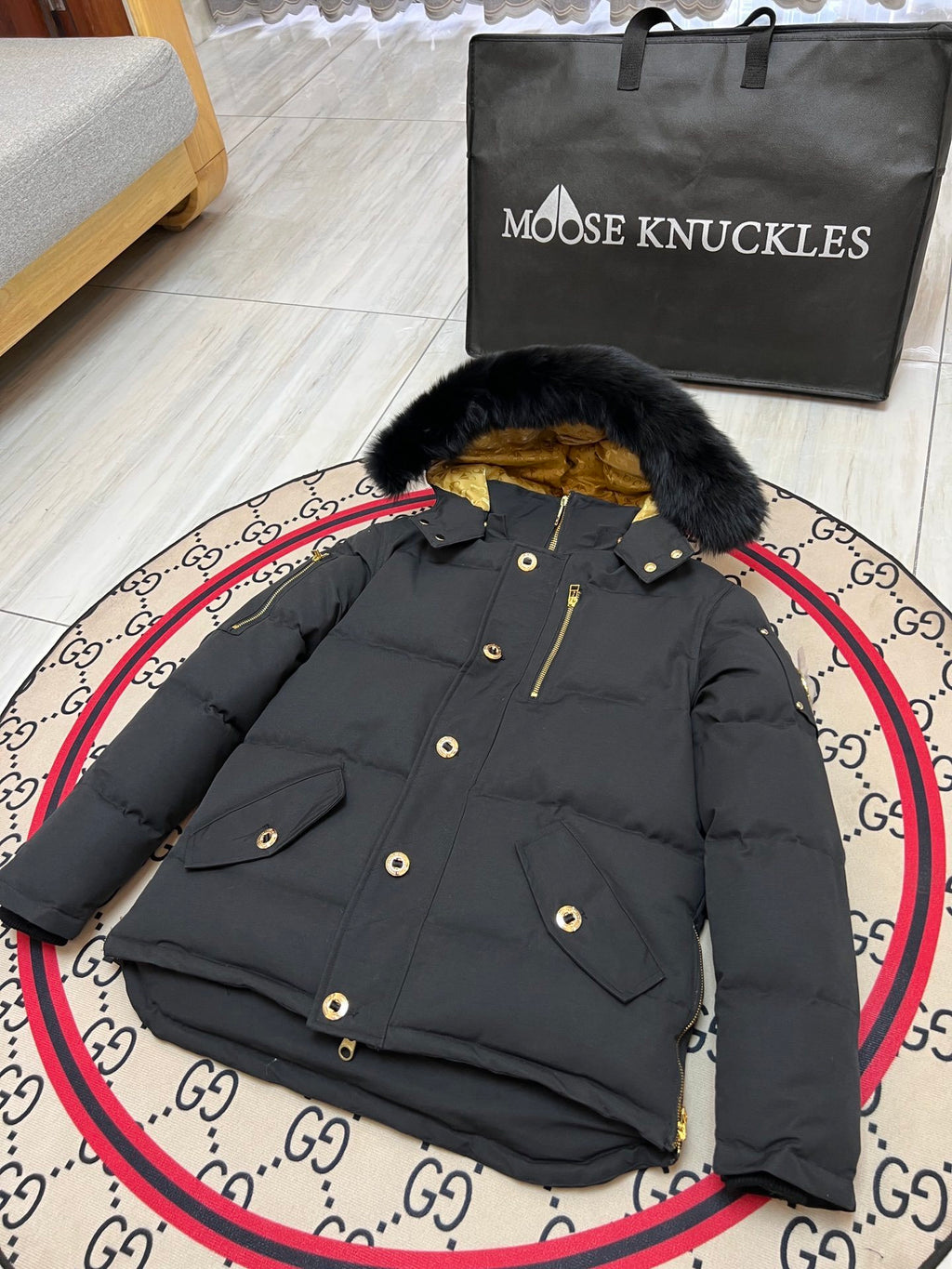 Moose Knuckles Black Hooded Puffer Jacket with Gold-Tone Details