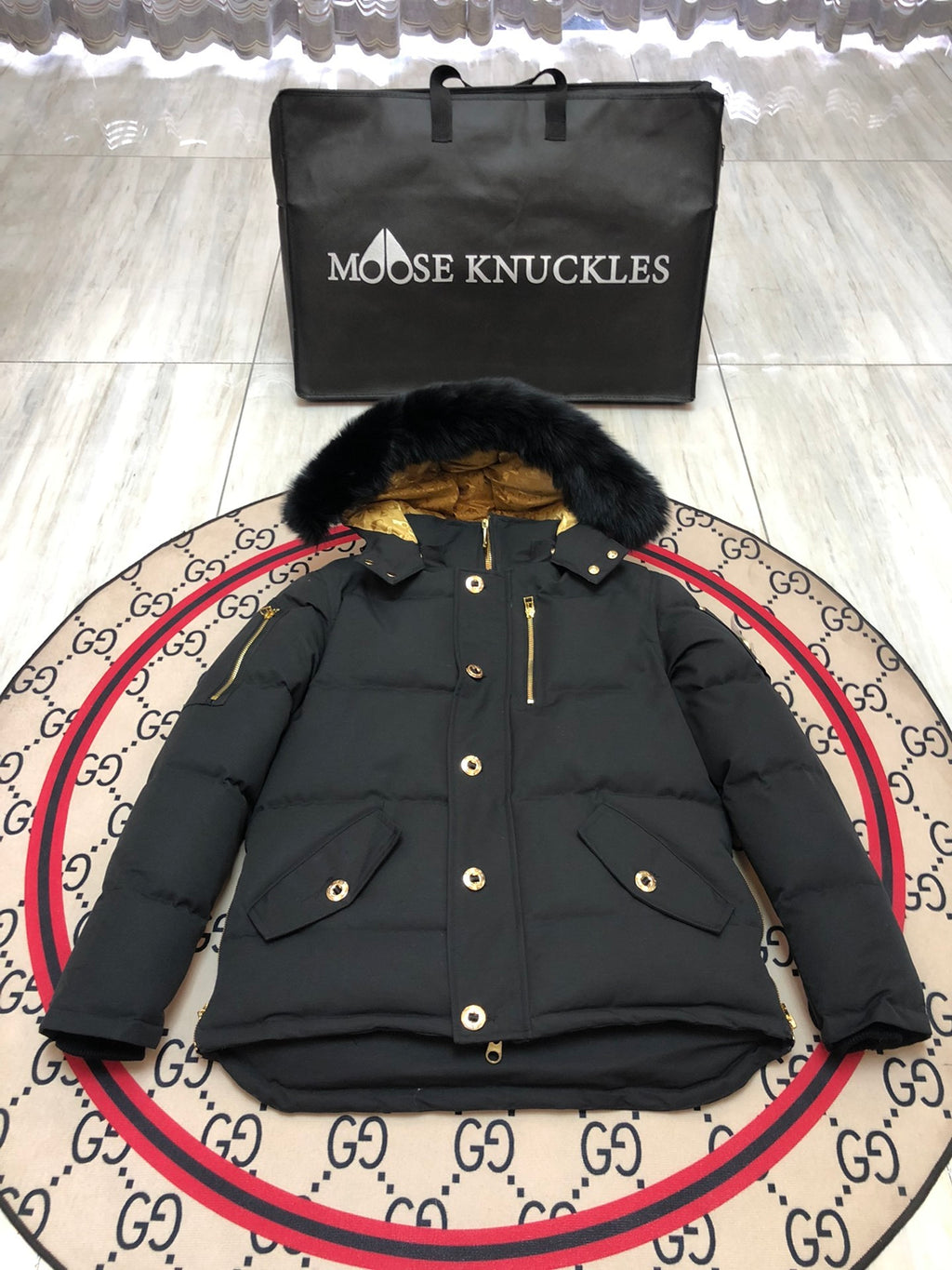 Moose Knuckles Black Hooded Puffer Jacket with Gold-Tone Details