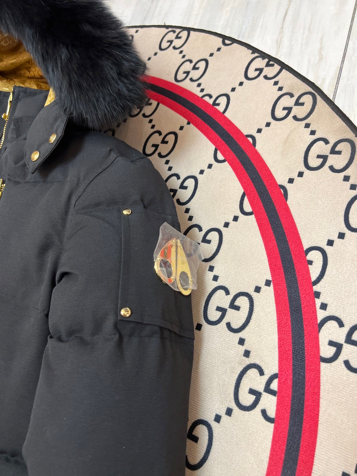 Moose Knuckles Black Hooded Puffer Jacket with Gold-Tone Details
