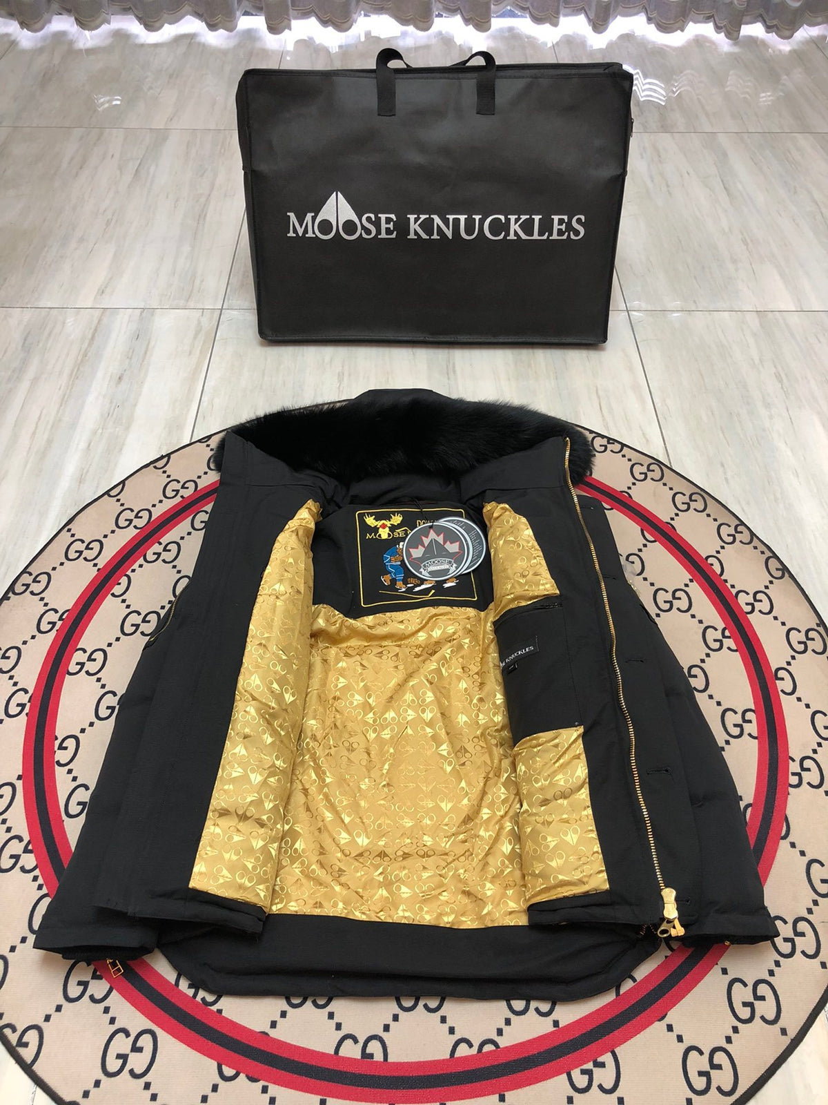 Moose Knuckles Black Hooded Puffer Jacket with Gold-Tone Details