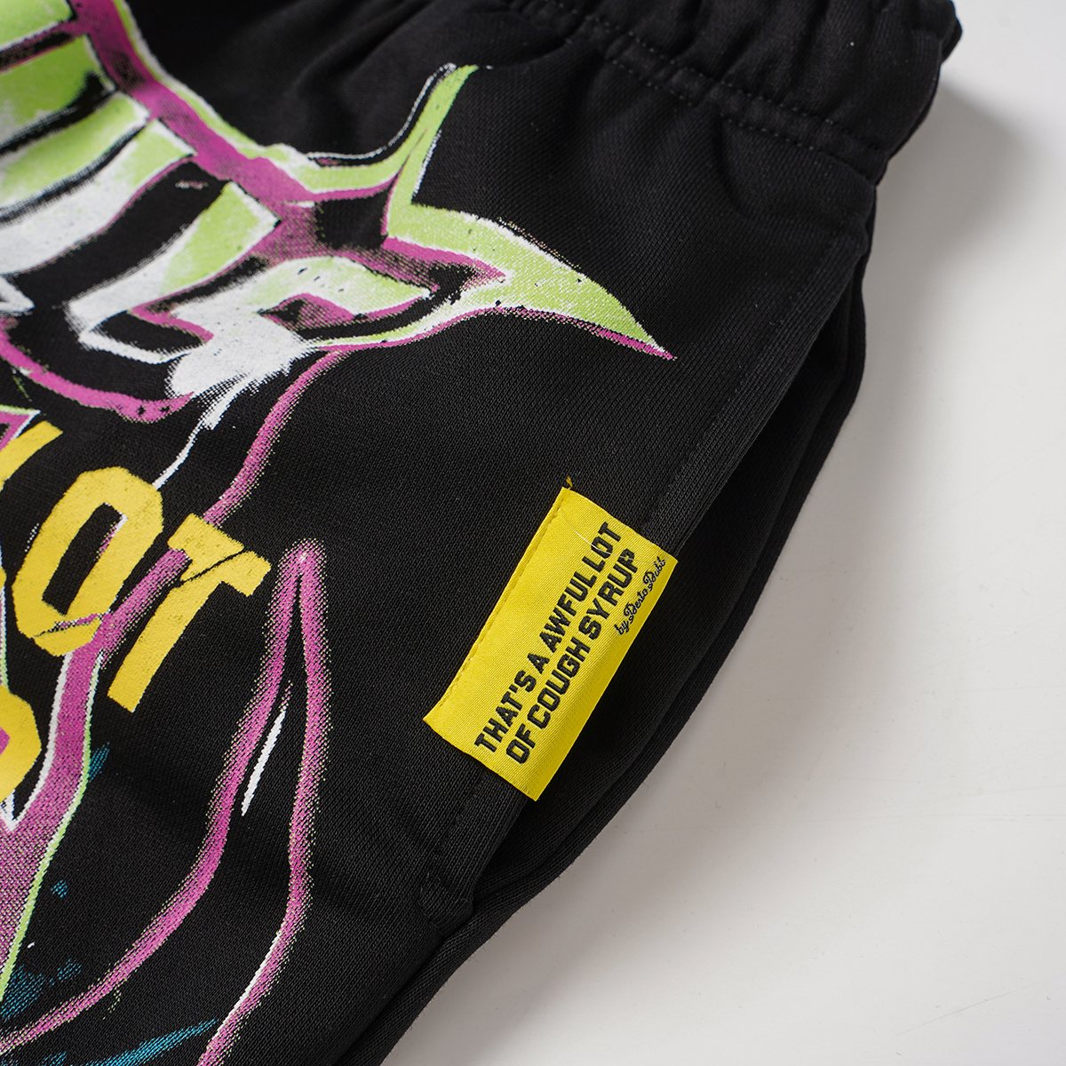 THAT'S A AWFUL LOT OF COUGH SYRUP Black Graphic Drawstring Shorts