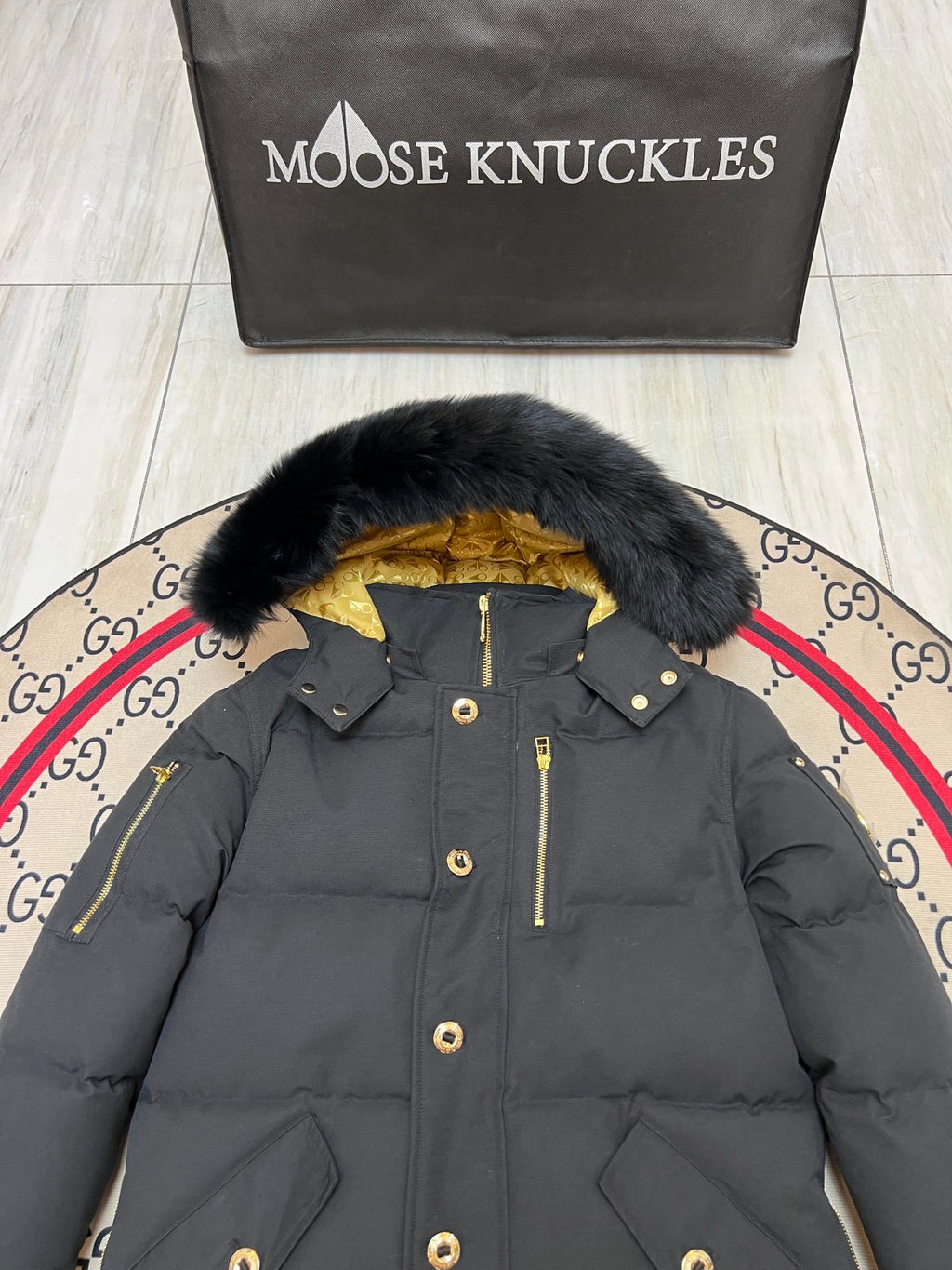 Moose Knuckles Black Hooded Puffer Jacket with Gold-Tone Details
