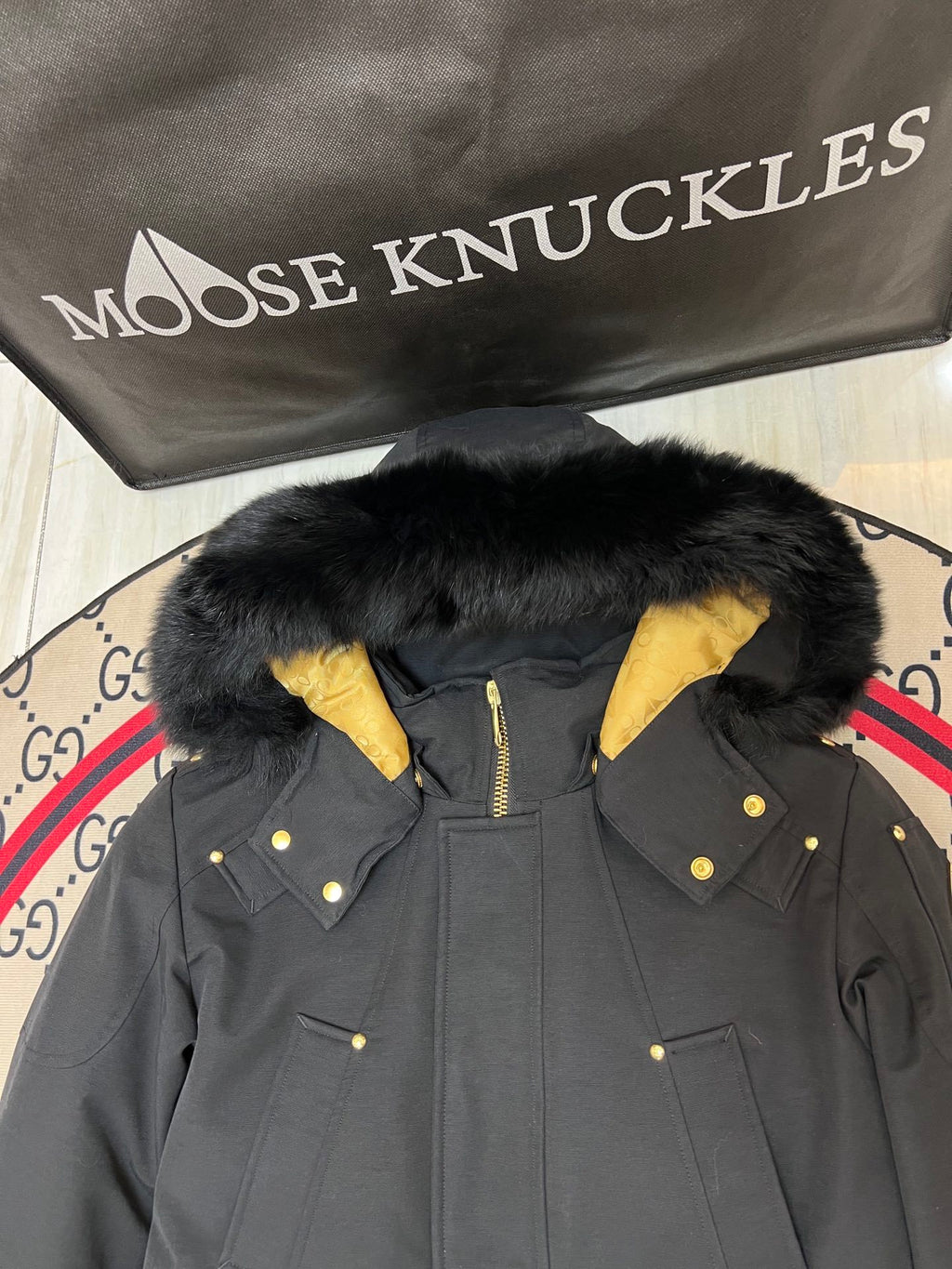 Moose Knuckles Black Long Hooded Parka with Gold-Tone Details