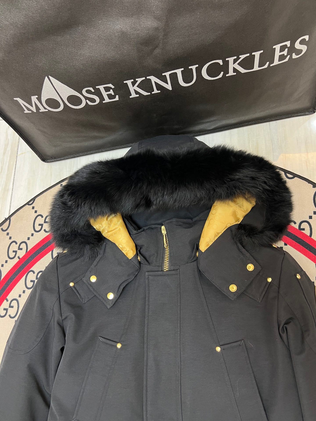 Moose Knuckles Black Long Hooded Parka with Gold-Tone Details